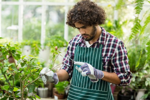 Worker recording an incident report during garden maintenance