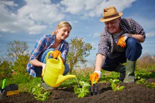 Gardener operating equipment with safety signage in place